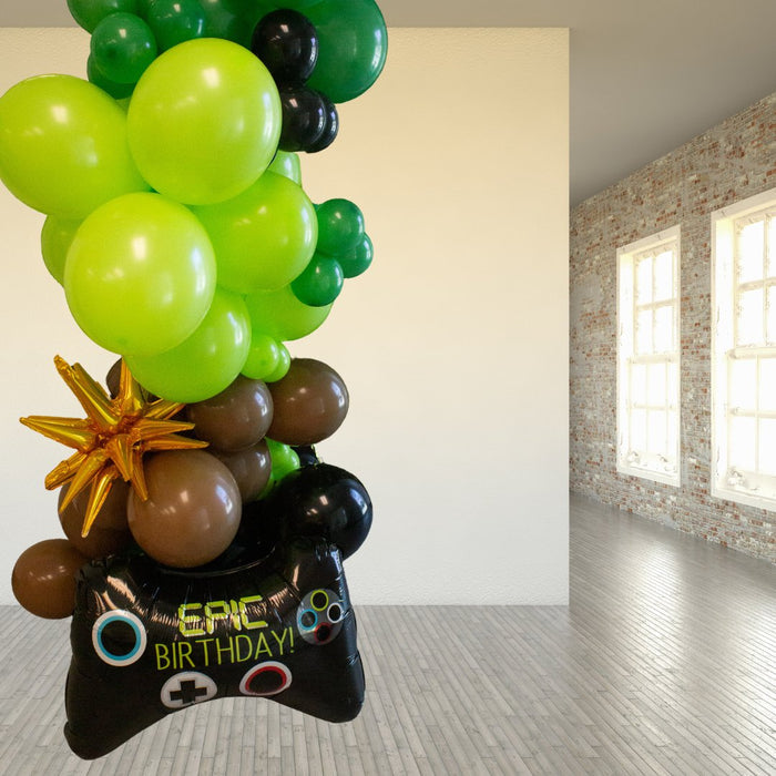 Balloon garland with star topper and game controller balloon plus green and black balloons