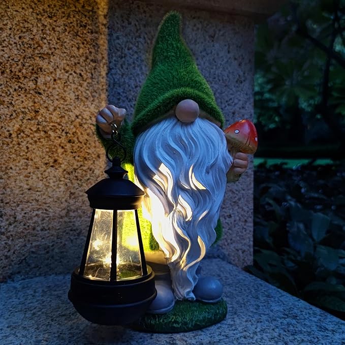 Glowing solar lantern beside a green-hat gnome statue holding a red mushroom