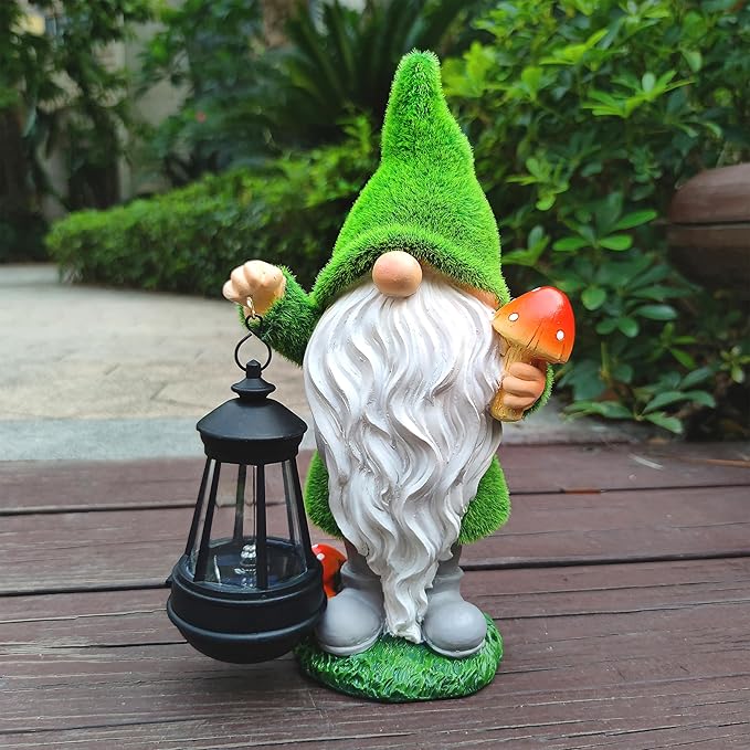 Solar garden gnome statue standing on patio, green hat, white beard, holding red mushroom