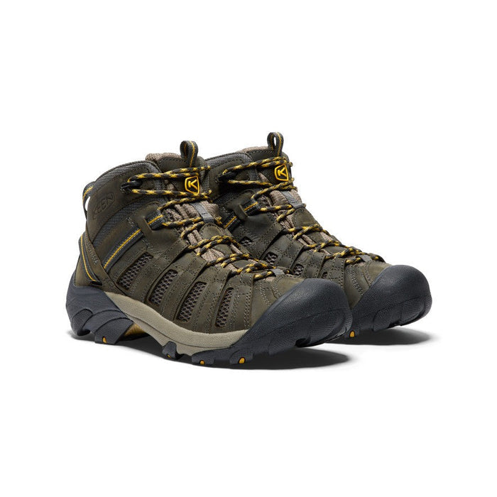 Keen Voyageur Mid hiking boots in olive green with breathable mesh panels, leather overlays, and durable rubber outsole, front angle view.