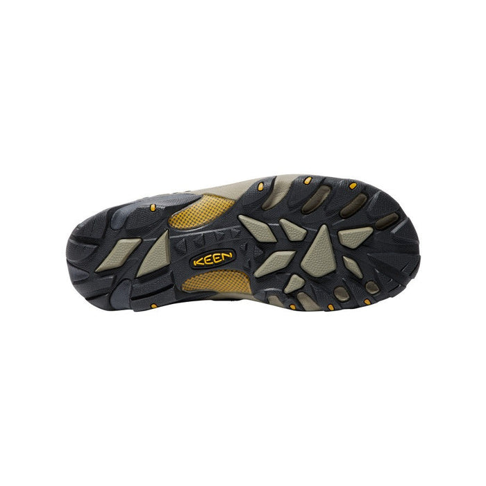 Keen Voyageur Mid hiking boots outsole with multi-directional lugs in black and beige rubber for enhanced traction.