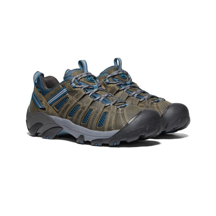 Keen Voyageur hiking shoes in brown and blue with mesh panels, durable leather upper, and rugged outsole, front angle view.