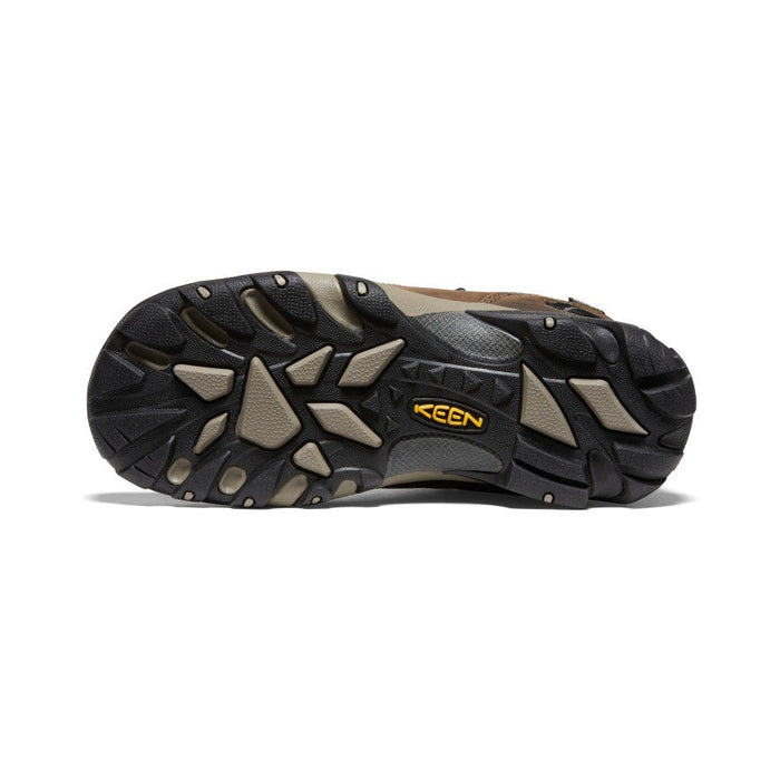 Keen Voyageur hiking shoes outsole with multi-directional lugs and durable rubber in black and tan, bottom view.