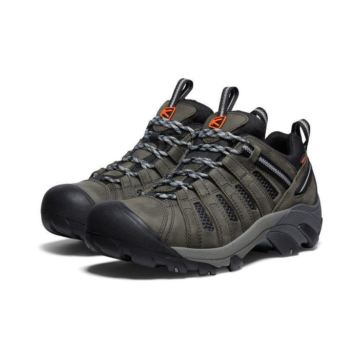 Keen Voyageur hiking shoes in olive green and black with durable leather and mesh upper, breathable design, and rugged outsole, front angle view.