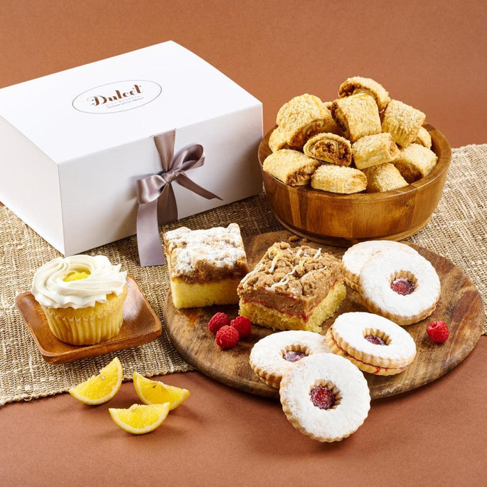Wedding gift basket with assorted cookies and cake slices in a wooden bowl