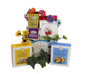 Welcome gift basket with assorted dessert boxes, cookies, and decorative flowers