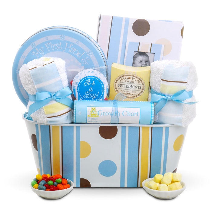 Blue striped baby gift basket with polka dots, tin, card, diapers, and candy bowls