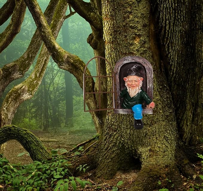 Garden gnome statue peeking from arched window in tree trunk, green coat and blue boots