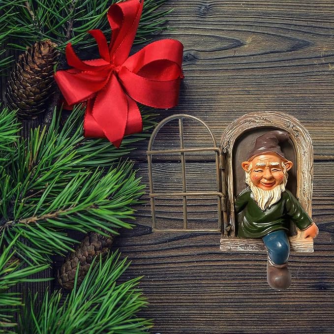 Garden gnome statue in arched window frame with red bow, green coat and blue pants