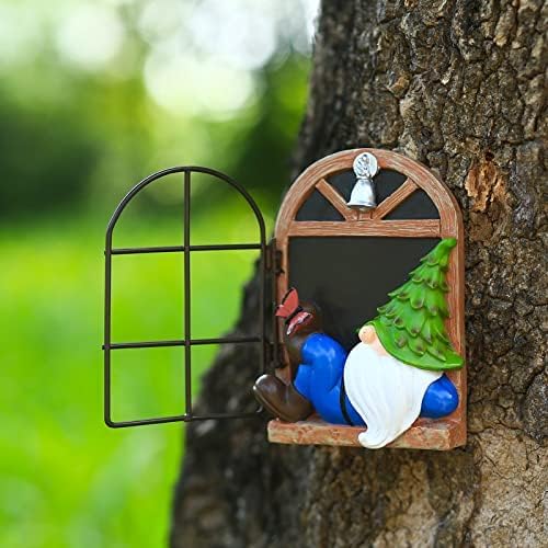 Tree face garden decor featuring a blue-and-white gnome with a green hinged tree