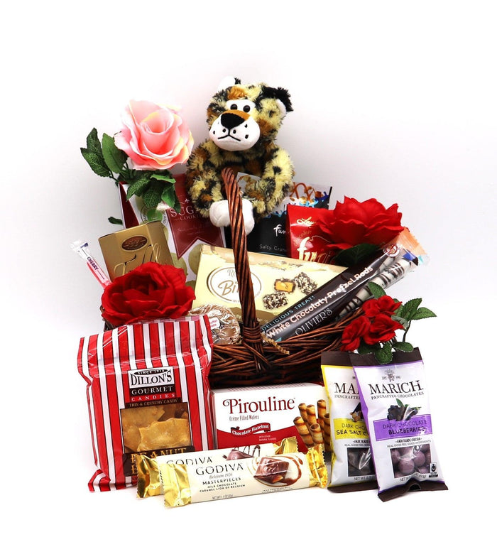Gift basket with plush lion and tiger, red roses, and assorted chocolates and treats
