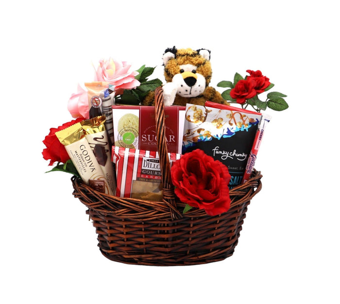 Gift basket with plush tiger, pink rose and red flowers, and assorted chocolates in basket