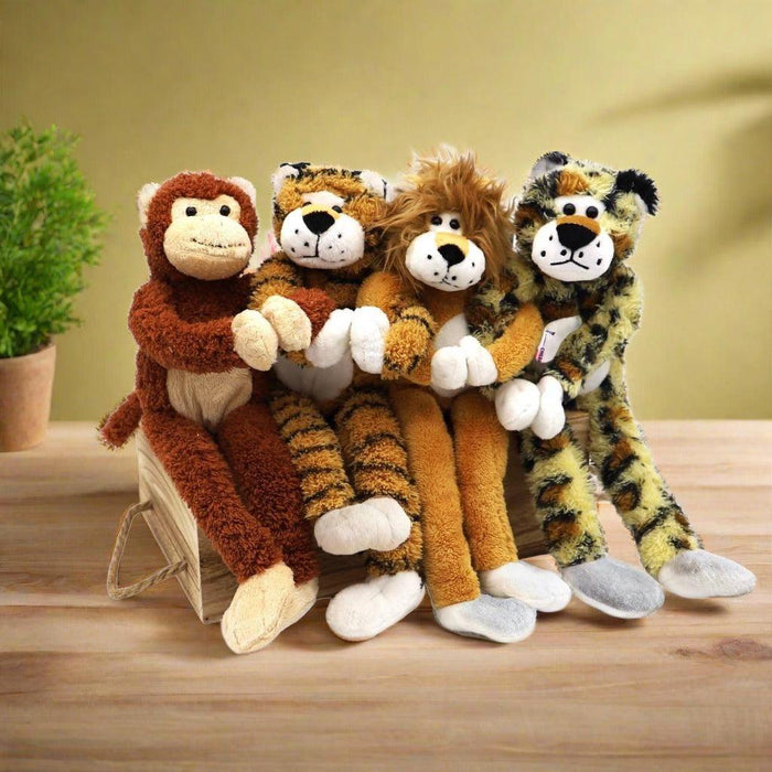 Gift basket with multiple plush jungle animals, red roses, and assorted chocolates and treats