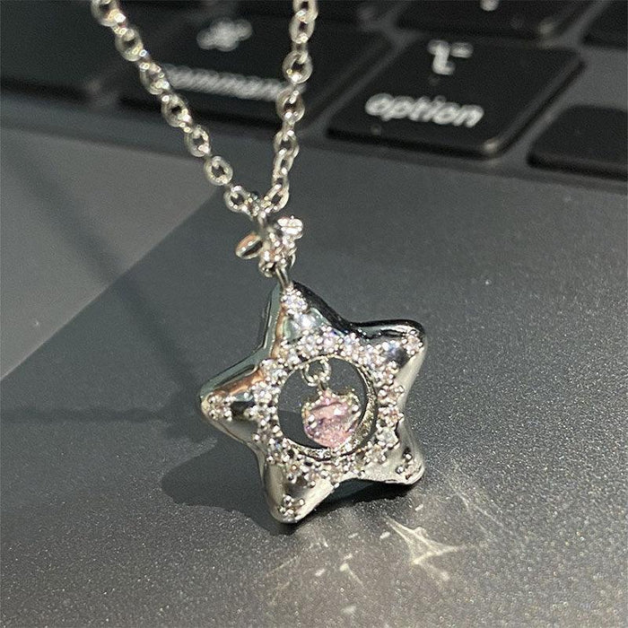 Star pendant necklace with silver chain, pink center and clear sparkle stones