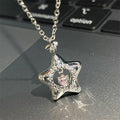 Star pendant necklace with silver chain, pink center and clear sparkle stones