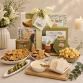 Gift basket with cutting board, assorted snacks and cheeses, and green-striped bow