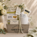 With Sympathy gift basket with mug, tea pouches, and snack boxes in wooden tray