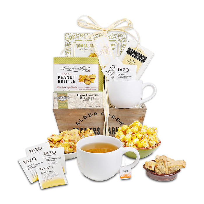 With Sympathy gift basket set with white mug, tea packs, cookies, and peanut brittle