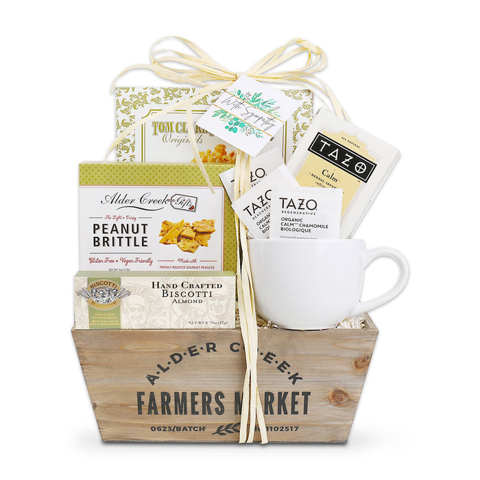With Sympathy gift basket with mug, tea sampler packs, and peanut brittle box