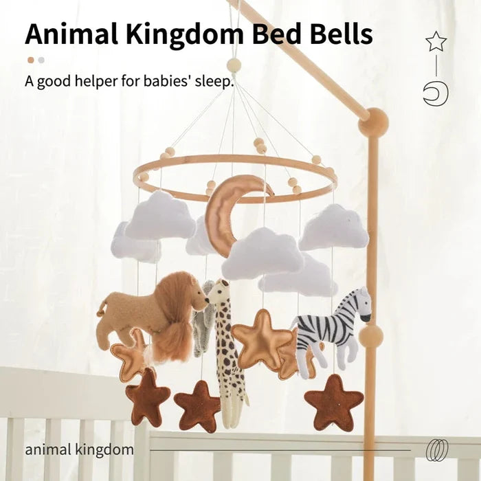 Crib bed bell mobile with felt animal and star toys suspended from a wooden frame