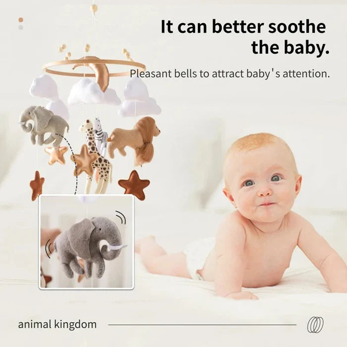 Crib bed bell mobile featuring felt animals and stars hanging from a wooden ring