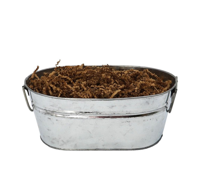 Galvanized metal bucket filled with brown shredded gift filler