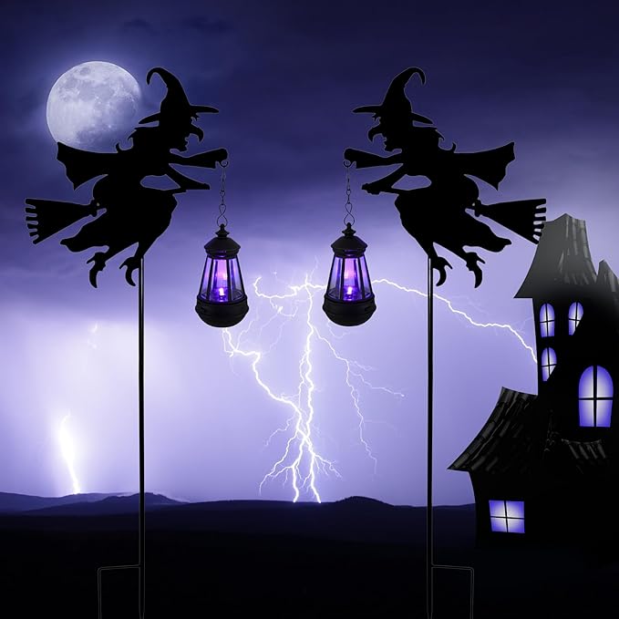 Pair of metal solar stake witch figurine lantern lights with purple glowing bulbs
