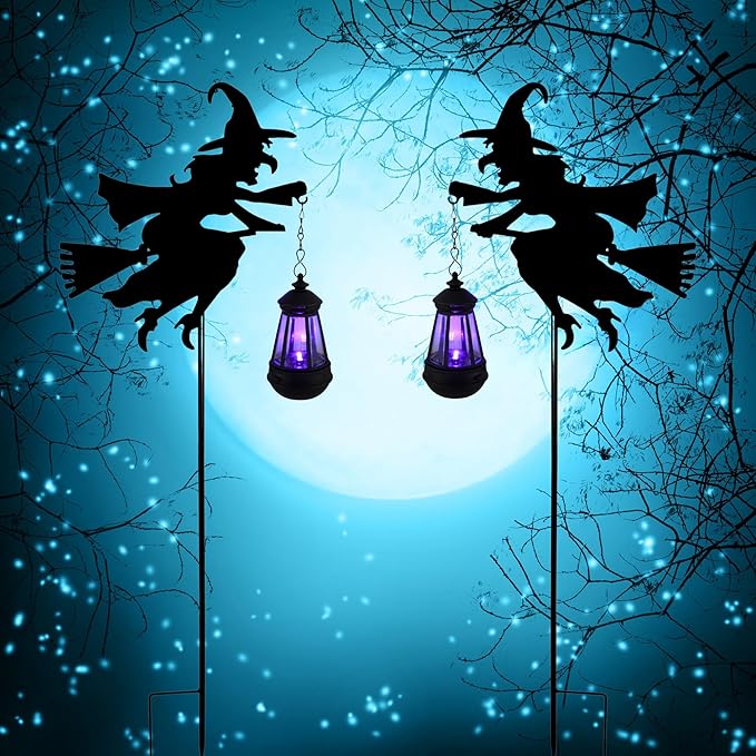 Two witch silhouette solar stake lantern lights with purple glowing lanterns