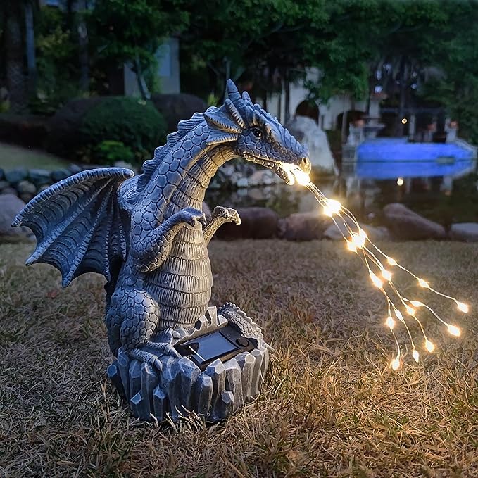Blue dragon garden statue with solar LED light strings, perched on a rock base
