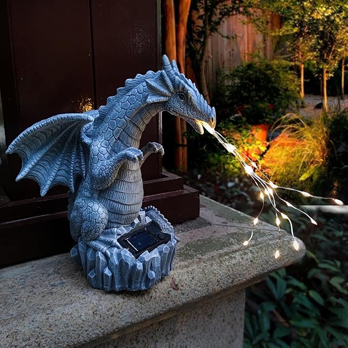 Blue dragon solar garden statue with illuminated LED string lights on stone pedestal