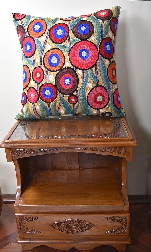 Multicolor embroidered pillow cover featuring circular flower motifs