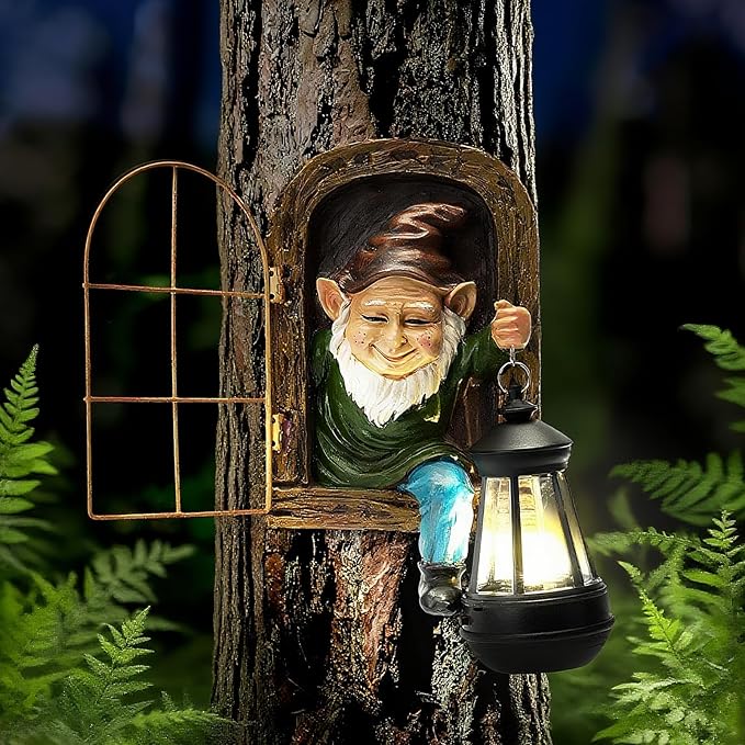 Outdoor resin garden gnome statue holding a solar lantern on a tree trunk