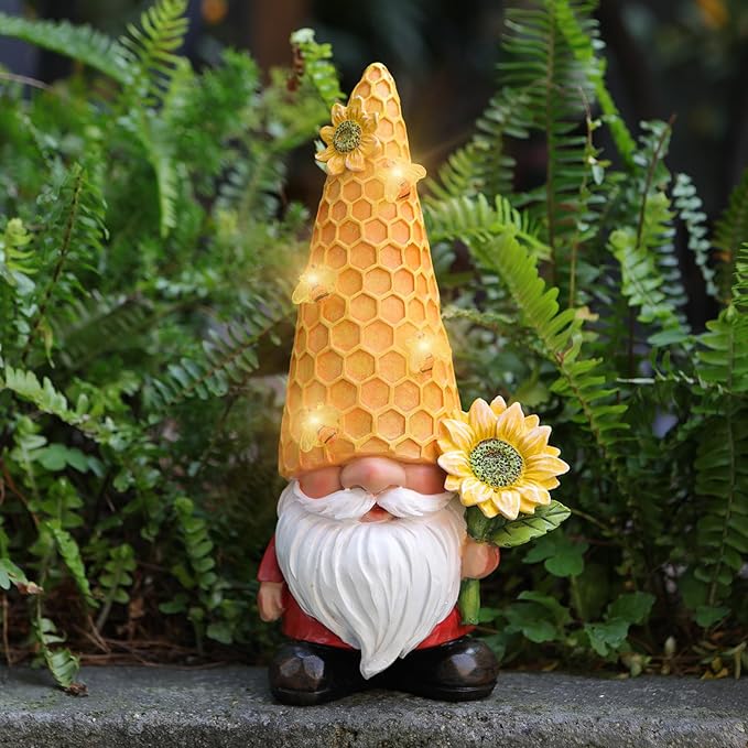 Solar LED garden gnome statue with honeycomb hat and sunflower, glowing outdoors