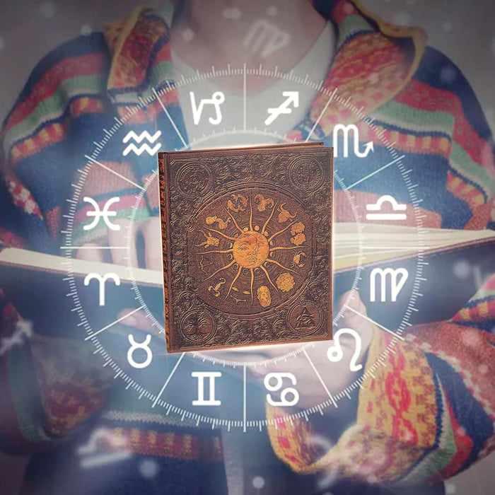 Zodiac scrapbook album with embossed sun artwork placed over a star chart cloth